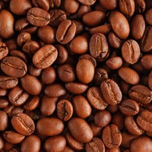 A close up of coffee beans on the ground